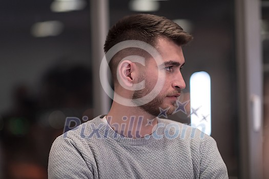 Portrait of happy millennial male business owner in modern office. Businessman, smiling and looking at camera. Leadership concept. Head shot. High-quality photo Portrait of happy millennial male business owner in modern office. Businessman, smiling and looking at camera. Leadership concept. Head shot. High-quality photo