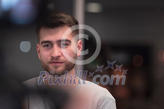 Portrait of happy millennial male business owner in modern office. Businessman, smiling and looking at camera. Leadership concept. Head shot. High-quality photo Portrait of happy millennial male business owner in modern office. Businessman, smiling and looking at camera. Leadership concept. Head shot. High-quality photo