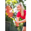 Pretty, young woman tennis player playing on a clay court. Healthy active lifestyle concept