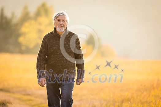 Happy senior man enjoying a lovele autumn day outdoors Happy senior man enjoying a lovele autumn day outdoors