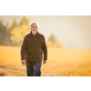 Happy senior man enjoying a lovele autumn day outdoors