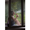 Mid-aged woman lighting a cigarette at home, getting her nicotine daily dose, unable to resist to her unhealthy habit