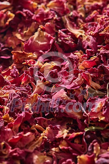 Natural pink colored dried rose petals, close up, vertical backdrop. Creative backdrop for spa and beauty salon. Natural pink colored dried rose petals, close up, vertical backdrop. Creative backdrop for spa and beauty salon.