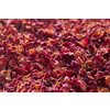 Natural dried pink rose petals in selective focus, close up, horizontal backdrop. Beautiful backdrop with floral theme.