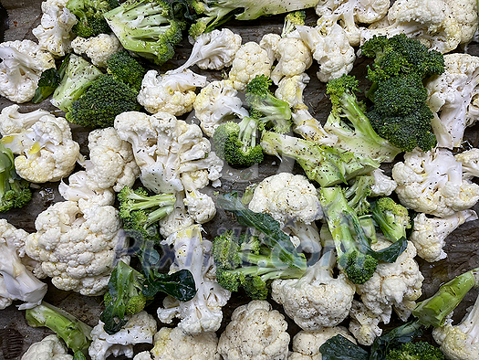 Broccoli and cauliflower cut and ready for cooking, baking, steaming. Healhty lunch or diiner. Broccoli and cauliflower cut and ready for cooking, baking, steaming. Healhty lunch or diiner.