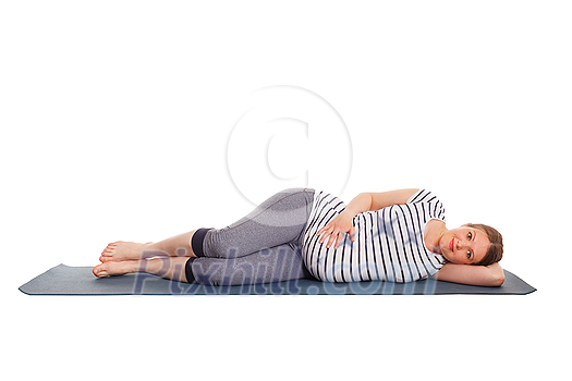 Pregnancy yoga exercise - pregnant woman doing yoga asana Parsva Savasana Side Fetal Pose or Side Lying Corpse Pose isolated on white background Pregnancy yoga exercise - pregnant woman doing yoga asana Parsva Savasana Side Fetal Pose or Side Lying Corpse Pose isolated on white background
