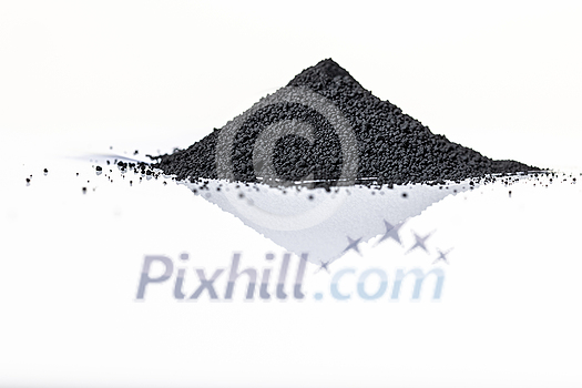 Iron nanoparticles in a lab, on a white glossy surface Iron nanoparticles in a lab, on a white glossy surface