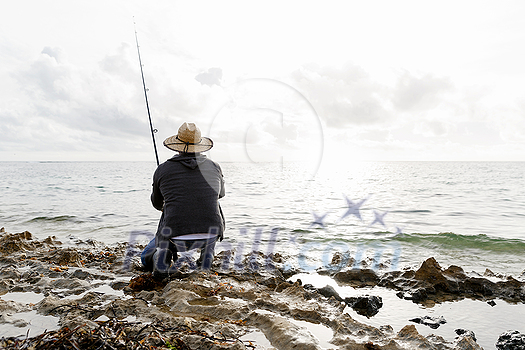 Picture of fisherman fishing with rods Picture of fisherman fishing with rods