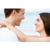 Portraits of romantic young couple on the beach