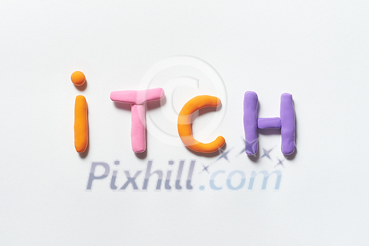 Itch word formed of colorful plasticine on white background. Skin disease and medical treatment concept. Itch word formed of colorful plasticine on white background. Skin disease and medical treatment concept.