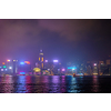 Hong Kong skyline cityscape downtown skyscrapers over Victoria Harbour in the evening illuminated with lasers with tourist boat ferries . Hong Kong, China