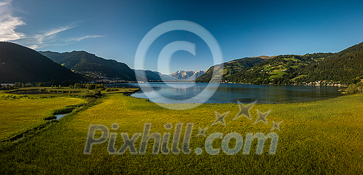 The panorama with Kitzsteinhorn(Tauern Alps) and Zell am See in the Zell am See-Kaprun region, Austrian Alps, Salcburgerland The panorama with Kitzsteinhorn(Tauern Alps) and Zell am See in the Zell am See-Kaprun region, Austrian Alps, Salcburgerland