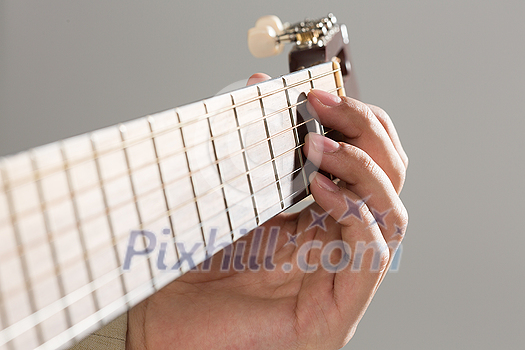 Close up of male hands playing acoustic guitar Close up of male hands playing acoustic guitar