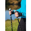 Nordic walking exercise adventure hiking concept - closeup of woman's hand holding nordic walking poles