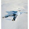 Happy young girl  lying in the snow