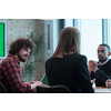Successful team. Group of young multi-ethnic business people working and communicating together in creative office. Selective focus. High-quality photo