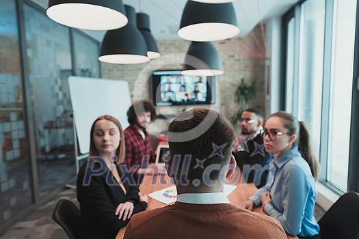 Successful team. Group of young multi-ethnic business people working and communicating together in creative office. Selective focus. High-quality photo Successful team. Group of young multi-ethnic business people working and communicating together in creative office. Selective focus. High-quality photo
