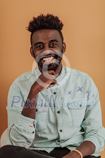 African student using laptop computer to study and make business connections yellow background. High quality photo