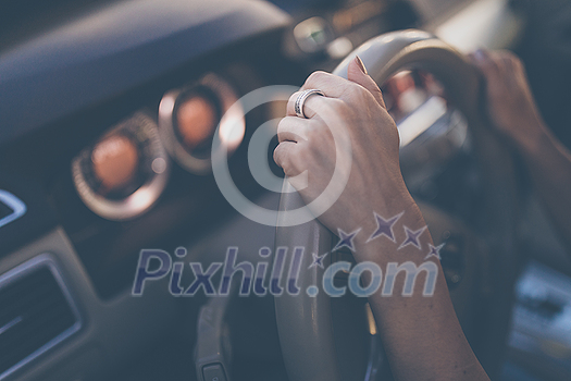 Pretty, young woman driving a car -Invitation to travel. Car rental or vacation. Pretty, young woman driving a car -Invitation to travel. Car rental or vacation.