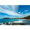 Mirissa beach in Sri Lanka in daytime with clouds and waves in sea