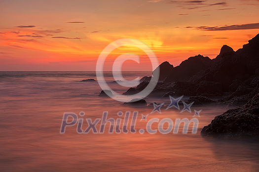 Sunset on Varkala beach popular tourist destination in Kerala state, South India. Long exposure water blur Sunset on Varkala beach popular tourist destination in Kerala state, South India. Long exposure water blur