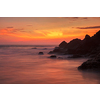 Sunset on Varkala beach popular tourist destination in Kerala state, South India. Long exposure water blur