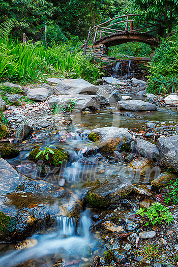 Small waterfall on mountain stream with small bridge. Jibi, Himachal Pradesh Small waterfall on mountain stream with small bridge. Jibi, Himachal Pradesh