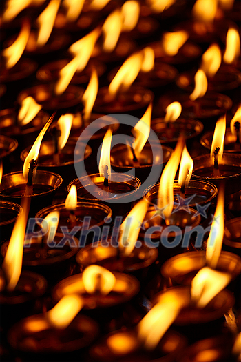 Burning candles in Buddhist temple. Dharamsala, Himachal Pradesh, India Burning candles in Buddhist temple. Dharamsala, Himachal Pradesh, India