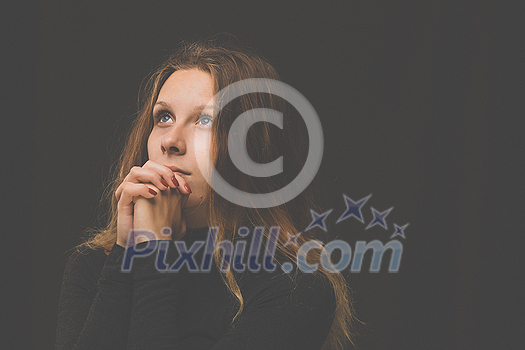Young woman praying to God. Christian life crisis prayer to god. Young woman praying to God. Christian life crisis prayer to god.
