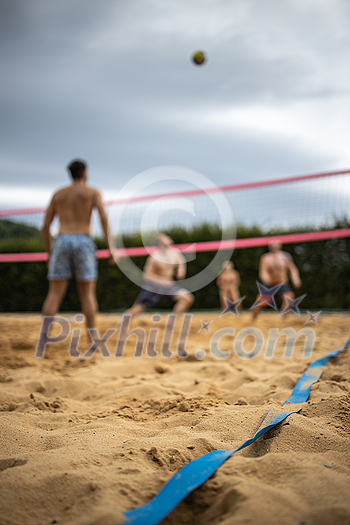 Group Of Friends Playing Volleyball On Beach Group Of Friends Playing Volleyball On Beach