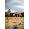 Group Of Friends Playing Volleyball On Beach