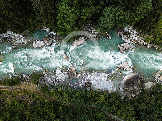 Aerial top view of a splendid whitewater on a mountain river in Swiss Alps Aerial top view of a splendid whitewater on a mountain river in Swiss Alps