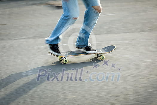 Skateboarder riding fast towards the ramps to be lifted into the air and perform a trick Skateboarder riding fast towards the ramps to be lifted into the air and perform a trick