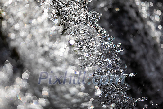 Water concept - river water flowing with light reflecting of its surface - fast exposure shot Water concept - river water flowing with light reflecting of its surface - fast exposure shot