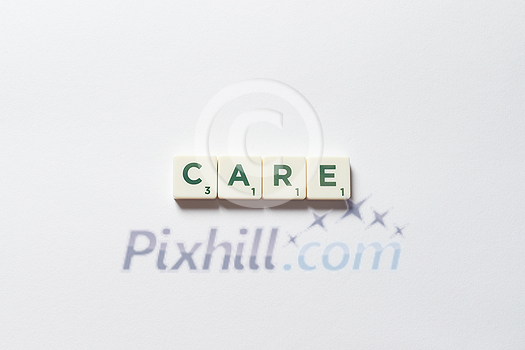 Care word formed of scrabble blocks over white background. Health insurance and protection concept. Care word formed of scrabble blocks over white background. Health insurance and protection concept.