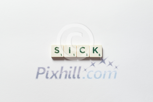 Sick word formed of scrabble blocks on white background. Sickness prevention and physical health awareness. Sick word formed of scrabble blocks on white background. Sickness prevention and physical health awareness.