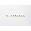 Diagnosis word formed of scrabble blocks on white background. Disease prevention and physical health awareness.