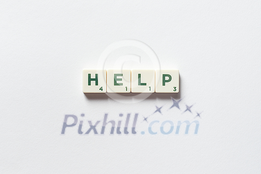 Help word formed of scrabble blocks over white background. Assistance and emergency concept. Help word formed of scrabble blocks over white background. Assistance and emergency concept.