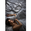 Pretty, young woman in her bed, fast asleep. Importance of sleep concept