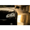 Young man washing his beloved car carefully in a manual car wash to prevent any damage and detail it properly