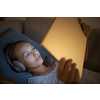 Pretty, young woman using a tablet computer at home in the evening