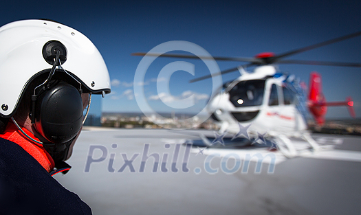 Modern medical helicopter on a hospital rooftop helipad Modern medical helicopter on a hospital rooftop helipad