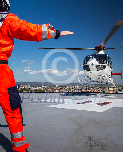 Modern medical helicopter on a hospital rooftop helipad Modern medical helicopter on a hospital rooftop helipad
