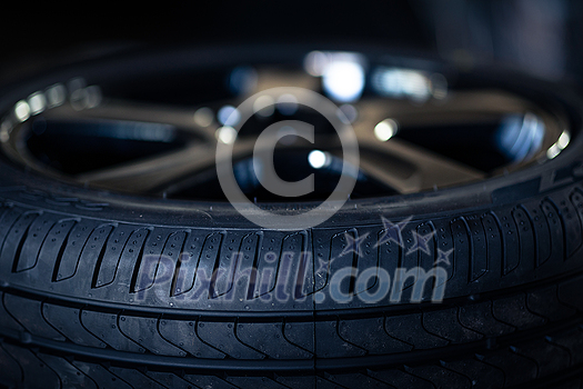 Automobile tire tread with a depth and light in the darkness , selective focus Automobile tire tread with a depth and light in the darkness , selective focus