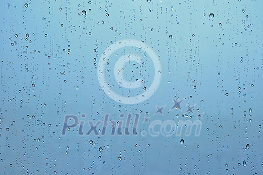 Rain water drops droplets on window glass texture background Rain water drops droplets on window glass texture background