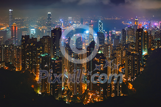 Famous view of Hong Kong - Hong Kong skyscrapers skyline cityscape view from Victoria Peak illuminated in the evening blue hour. Hong Kong, China