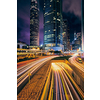 Street traffic in Hong Kong at night. Office skyscraper buildings and busy traffic on highway road with blurred cars light trails. Hong Kong, China