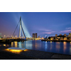 Erasmus Bridge (Erasmusbrug) and Rotterdam skyline illuminated at night. Rotterdam, Netherlands