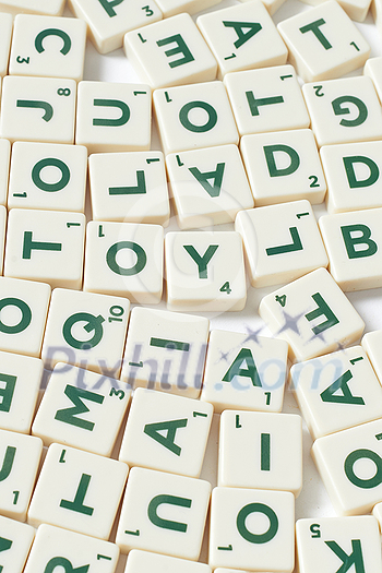 Scrabble letters, close up on white background. Original web template with creative elements. Scrabble letters, close up on white background. Original web template with creative elements.