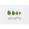 Natural word formed of scrabble tiles with green tree leaves on white background. Eco energy and natural resource conservation concept.
